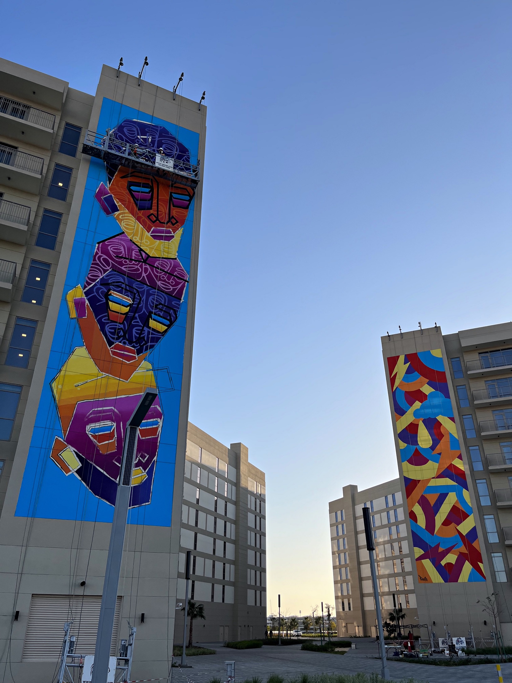 Two completed mural buildings within the coordinated Aldar site