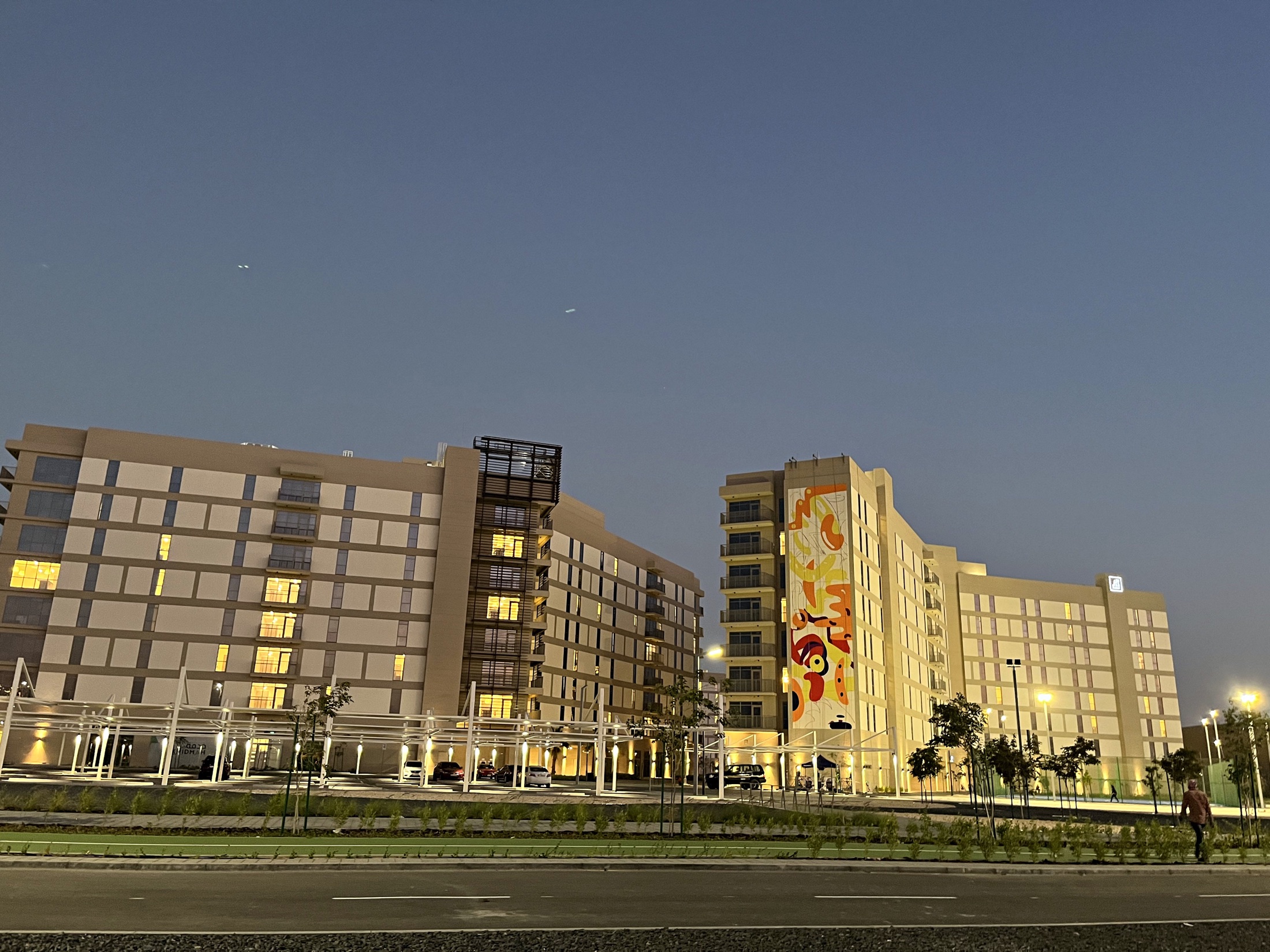 Completed Aldar mural illuminated within the Yas Island development at night