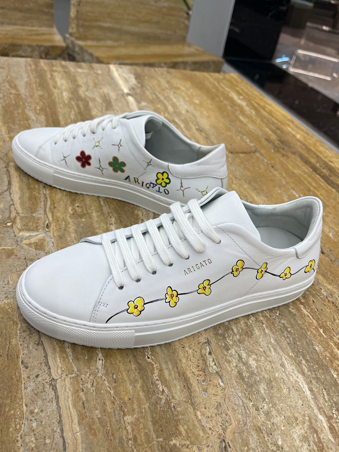 A finished pair of artist-customised Axel Arigato shoes
