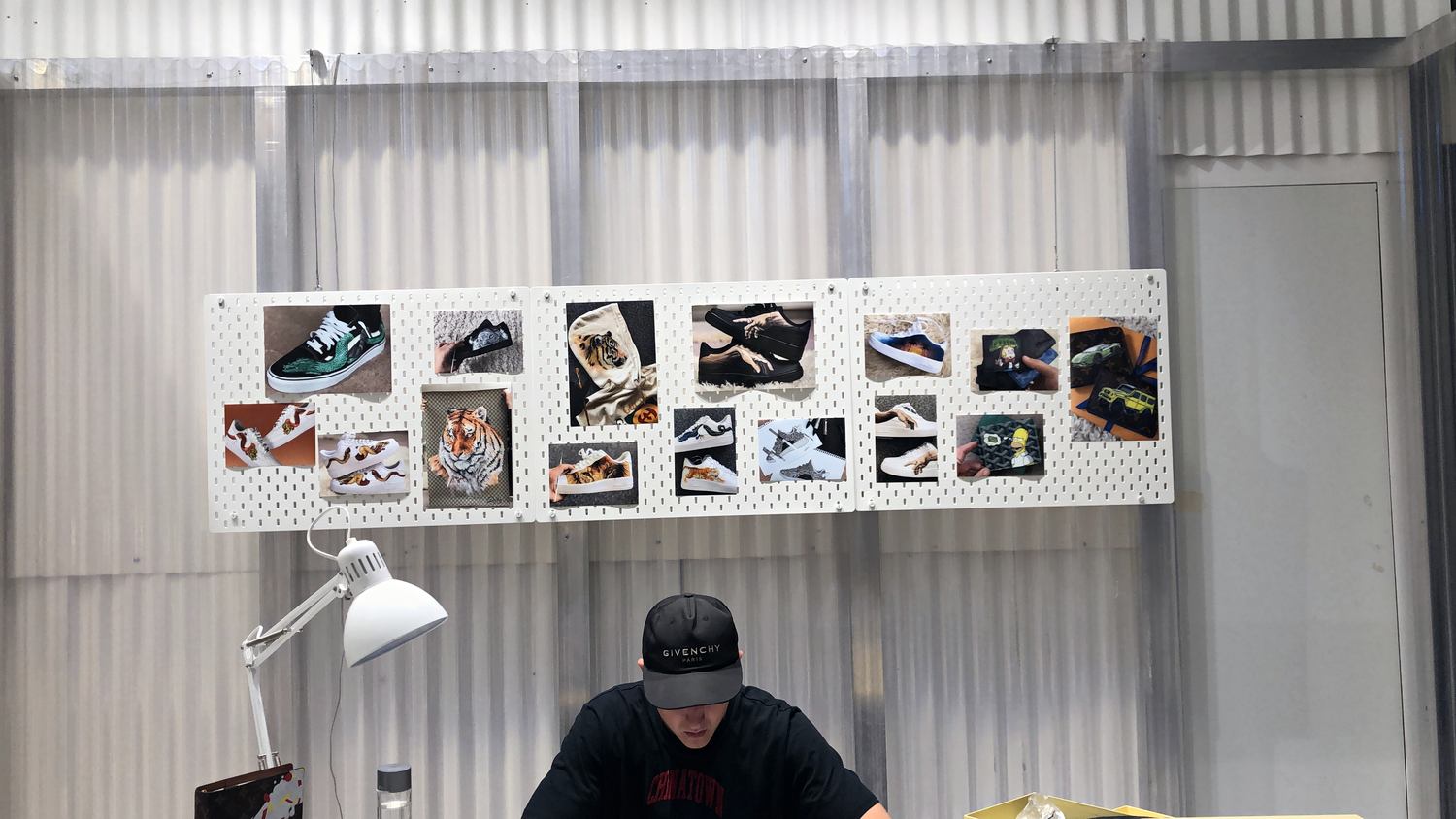 Live artist personalisation hub inside Level Shoes in Dubai
