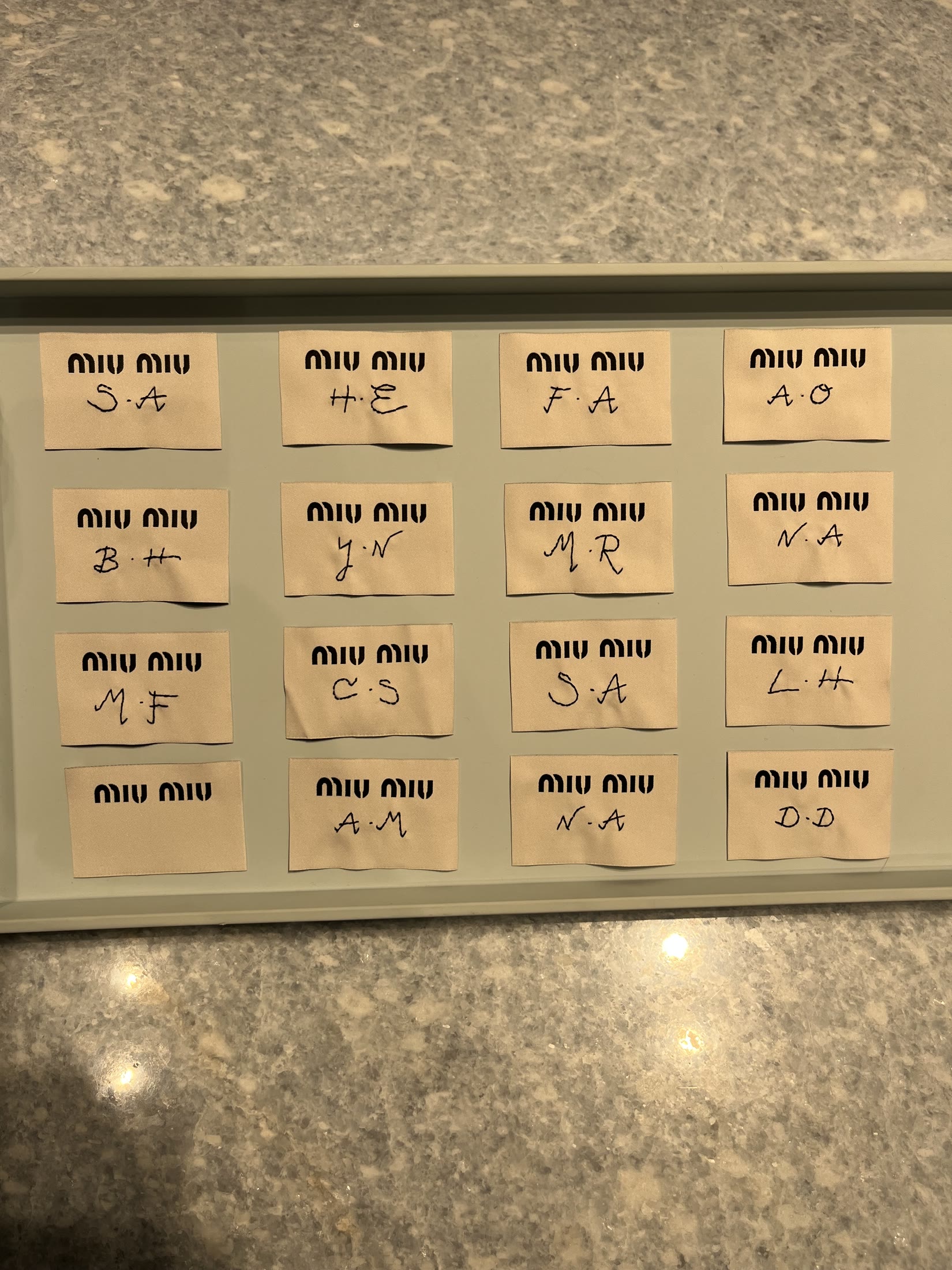 Miu Miu guest name cards prepared for personalisation