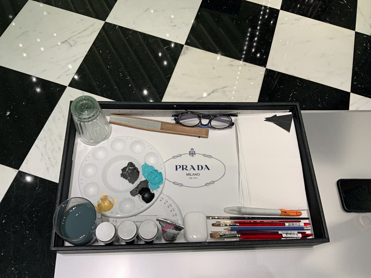 Hand-painted Prada gifting object prepared during the Dubai activation