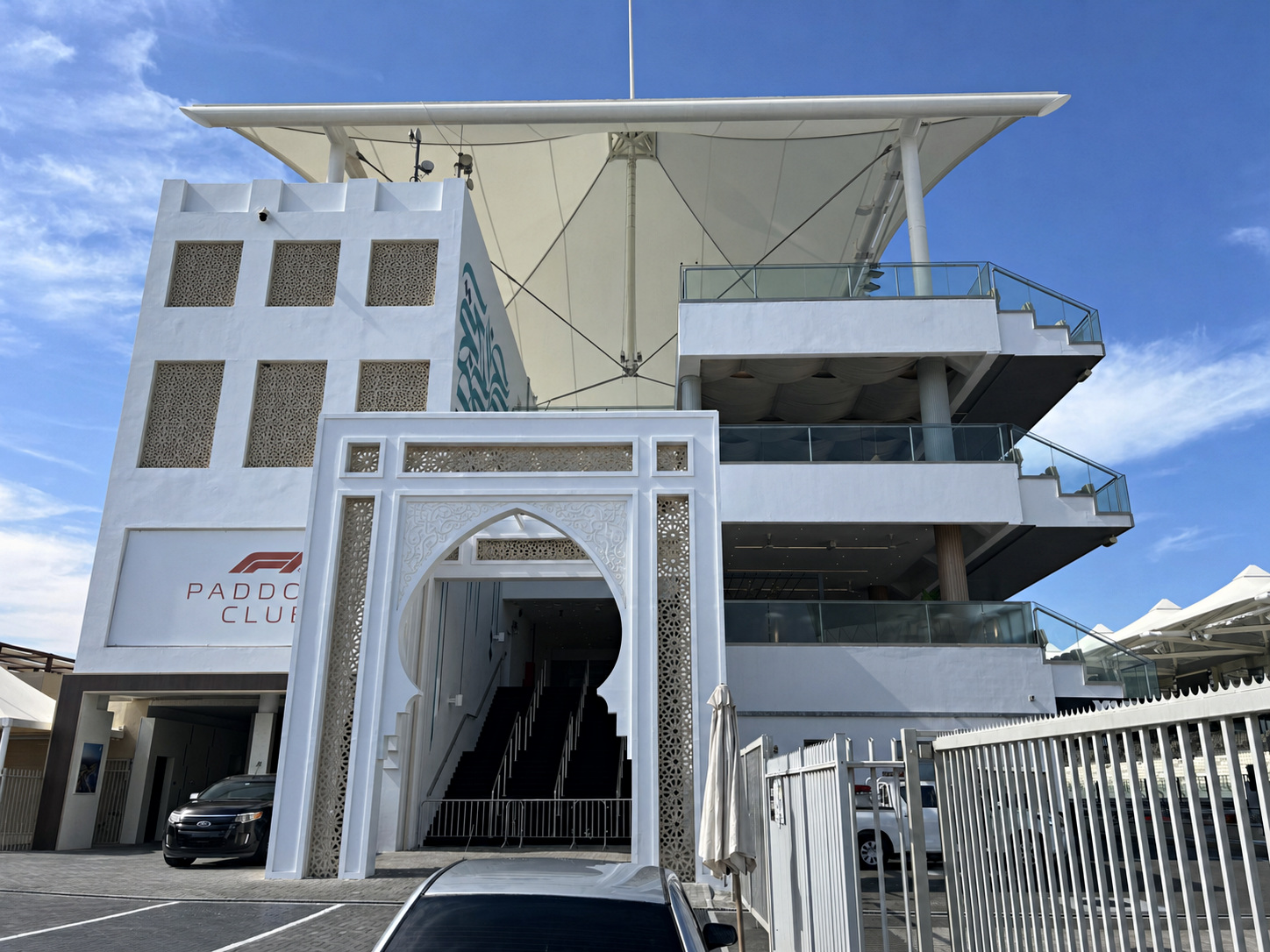 Completed Paddock Club exterior at Yas Marina Circuit with the monumental mural integrated into the architecture