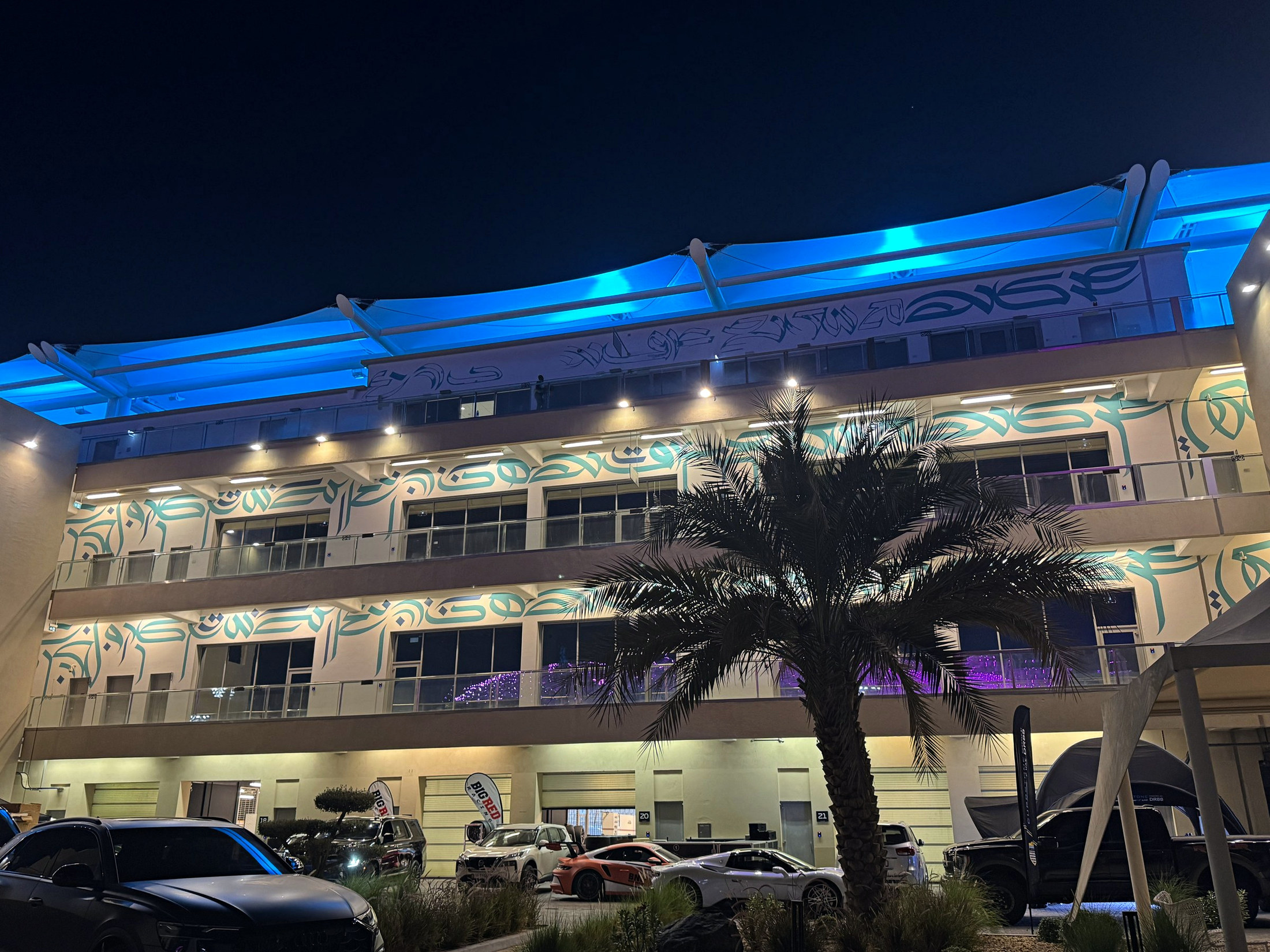 Completed mural spanning the illuminated Paddock Club