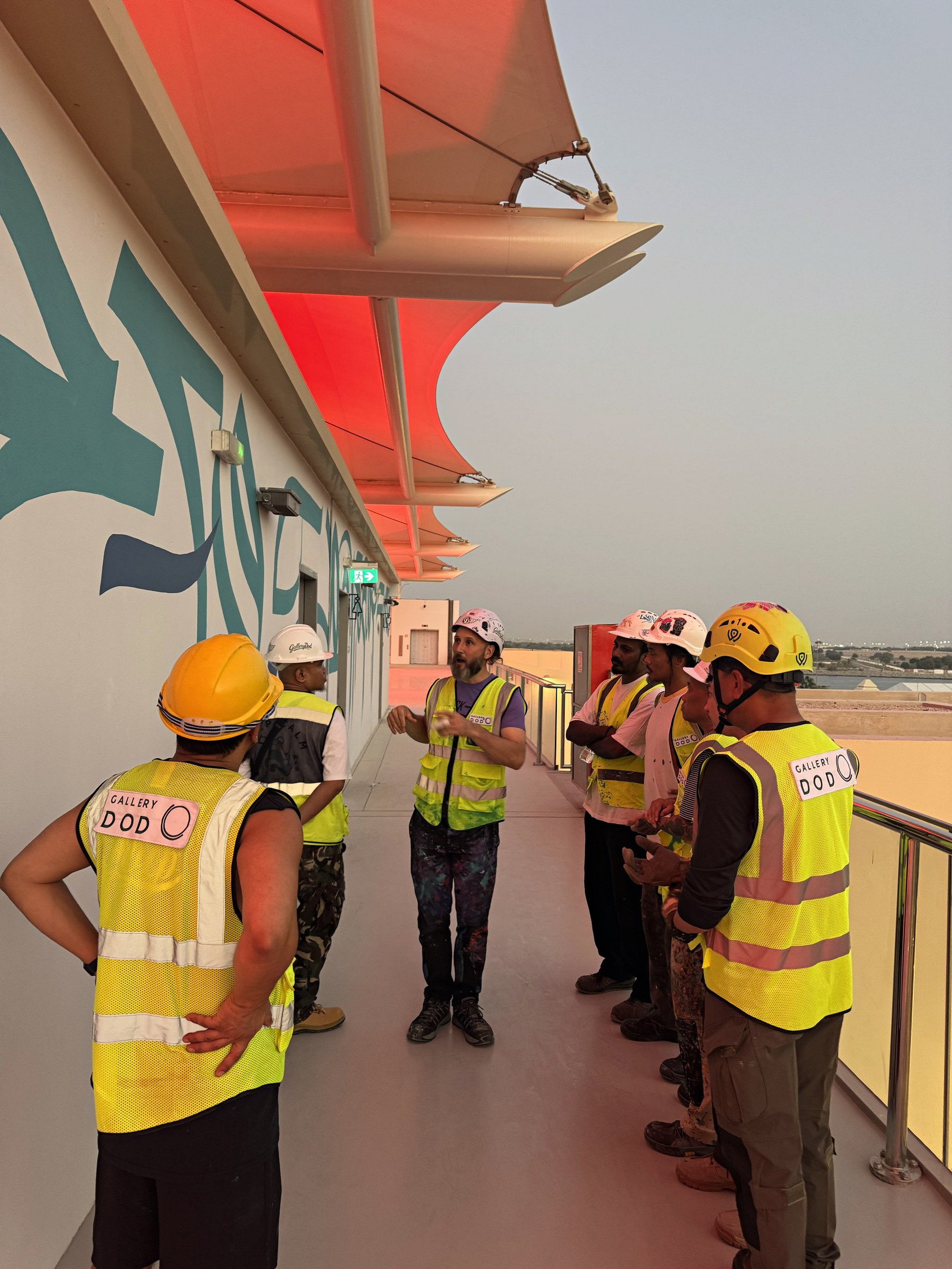 Gallery Dod team receiving an on-site briefing
